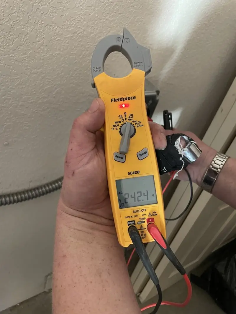 Voltage testing with clamp meter during Electrical Installation Services in Wheaton